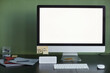 © Seventyfour - Background image of home office workplace with blank computer screen and smart speaker, copy space