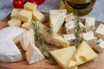 Wall Mural - Various kind of fresh cheese on board. Set of different cheeses. Top view. 