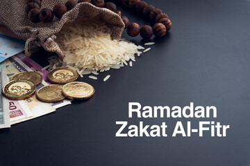 Sticker - ZAKAT words with Rice, Banknotes, Coins and Rosary Beads or Tasbih on Black Background. Zakat and Islamic Concept