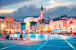 Beautiful city scenery in the central square with the old clock tower in Piran, the tourist center of Slovenia. popular tourist attraction. Wonderful exciting places.