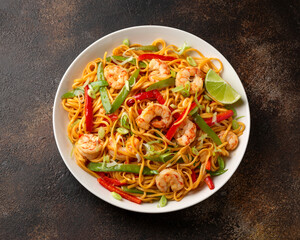 Wall Mural - Stir fry noodles with prawns and vegetables in white plate. Healthy asian food