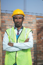 Portrait Of Construction Worker Of Indian Origin, Wear Safety Helmet 