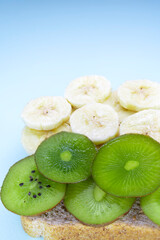 Wall Mural - Tropical fruits. Delicious sandwich. Bananas and kiwi