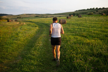 Wall Mural - man running  at sunset healthy active lifestyle