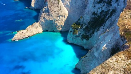 Wall Mural - Aerial seascape at the day time. Sea bay and rocks from drone. Blue water background in the summer. Travel and vacation video.