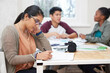 © Marius V/peopleimages.com - Sometimes you just gotta put your head down and study. Cropped shot of three university students studying.