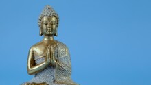 Zen.Buddha Statue On A Blue Background.Meditation And Relaxation Symbol.Buddhism Religion Background.Calm, Balance And Harmony. 4k Footage