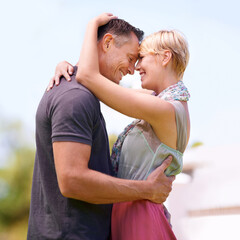 Canvas Print - Keeping the flame alive. Shot of a mature couple embracing outdoors.