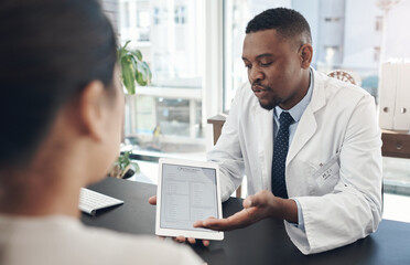 Wall Mural - This is just a formality. Shot of a young male doctor talking to a patient about a survey in an office.