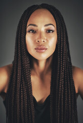 Aufkleber - Shes got it glowing on. Studio portrait of a beautiful young woman posing against a gray background.