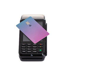 the plastic card lies on the payment terminal with a white isolated background