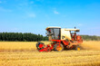 © zhengzaishanchu - combine harvester working on a wheat field