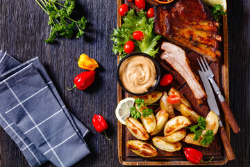 Poster - juicy roast pork ribs with veggies, top view