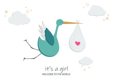 Cartoon Green Stork Flies In The Clouds With Stars. In The Beak Is A Bag Of A Newborn Girl. There Is A Pink Heart On The Bag. Lettering It's A Girl And Welcome To The World.
