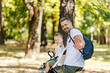 © Dusan Petkovic - Happy father and son on a bicycle in nature waving.
