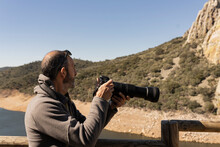 Man Photographing Birds In Monfrague National Park