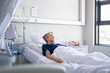 © Rido - Lonely old woman lying on hospital bed