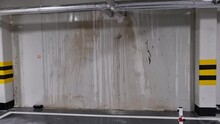 Water Stains On A Concrete Wall Of An Underground Garage, Pipe Malfunction