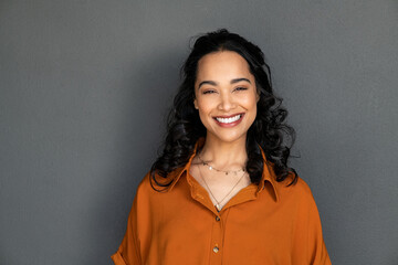 Wall Mural - portrait of happy young hispanic woman smiling
