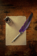 Poster - A quill pen with a vintage ink well and a piece of old paper, overhead flat lay shot