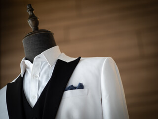 Wall Mural - Close up of white tuxedo jacket with black satin collar 