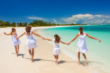 Wall Mural - Happy Caucasian family in white walking holding hands