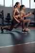 © astrosystem - Pretty women working out in a gym. Adult ladies with beautiful shaped bodies.