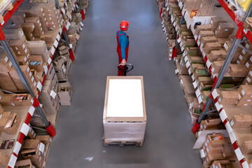 Poster - Man in hardhat working with pallet truck at warehouse, above view. Logistics center