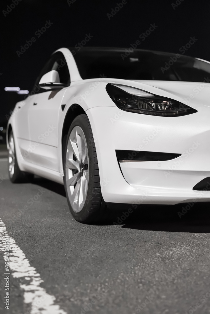 Tesla Front View Abstract Front view of Tesla electric car. Design, exterior and appearance of ...