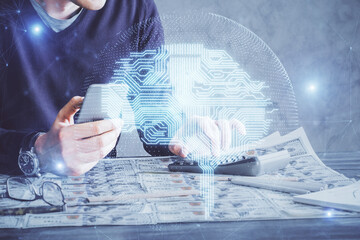 Fototapete - Double exposure of man's hand holding and using a digital device and brain hologram drawing. Data concept.