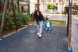 © Krakenimages.com - Mother and son playing on swing at park