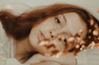 © Scopio - Portrait of young woman with glitter freckle and red hair