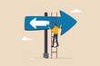Change to opposite direction, hesitate business decision to change to better opportunity, conflict or reverse direction, career path concept, businessman paint opposite direction arrow on arrow sign.