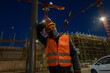 © Scopio - Tired and pensive construction worker outdoors at night