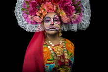 Woman With Sugar Skull Face Paint And Chiapas Dress  Against Dark Background