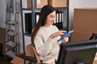 © Krakenimages.com - Young woman ecommerce business worker using touchpad at office