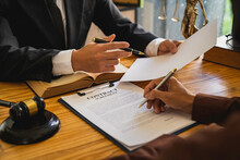 Attorneys Or Lawyers Who Are Reading The Statute Of Limitations Consultation Between Male Lawyers And Business Clients, Tax And Legal And Legal Services Firms.