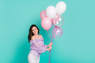 Sticker - Portrait of gorgeous friendly person hold balloons toothy smile isolated on turquoise color background