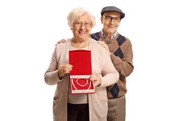 Sticker - Elderly man and woman holding a box with a pearl necklace and bracelet