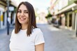 © Krakenimages.com - Young beautiful woman smiling happy outdoors on a sunny day of summer