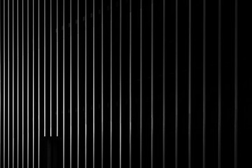 Wall Mural - Black striped facade. Dark background