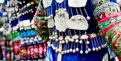 Chinese women in blue traditional festival clothes and silver accessories