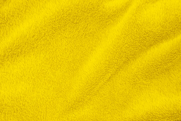 Yellow clean wool texture background. light natural sheep wool. yellow seamless cotton. texture of fluffy fur for designers. close-up fragment white wool carpet.