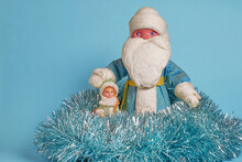 A Toy Russian Snow Maiden, Ded Moroz And Christmas Tree Tinsel