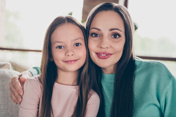 Poster - Photo of old dream positive lady embrace little girl daughter wear casual outfit in comfortable home indoors