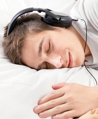 Wall Mural - Sleepy Young Man in Headphones