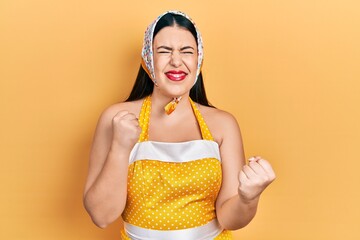 Poster - Young hispanic woman wearing pin up style celebrating surprised and amazed for success with arms raised and eyes closed