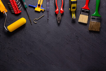 Sticker - Construction tools on black slate background. Construction concept