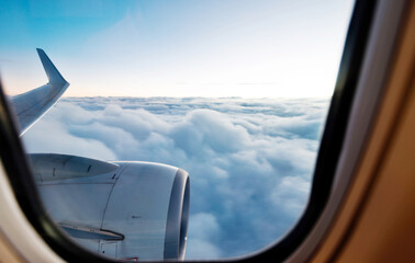 Canvas Print - Airplane engine and wings on the sky