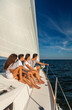 © Spotmatik - Latino family enjoying carefree lifestyle sailing the ocean